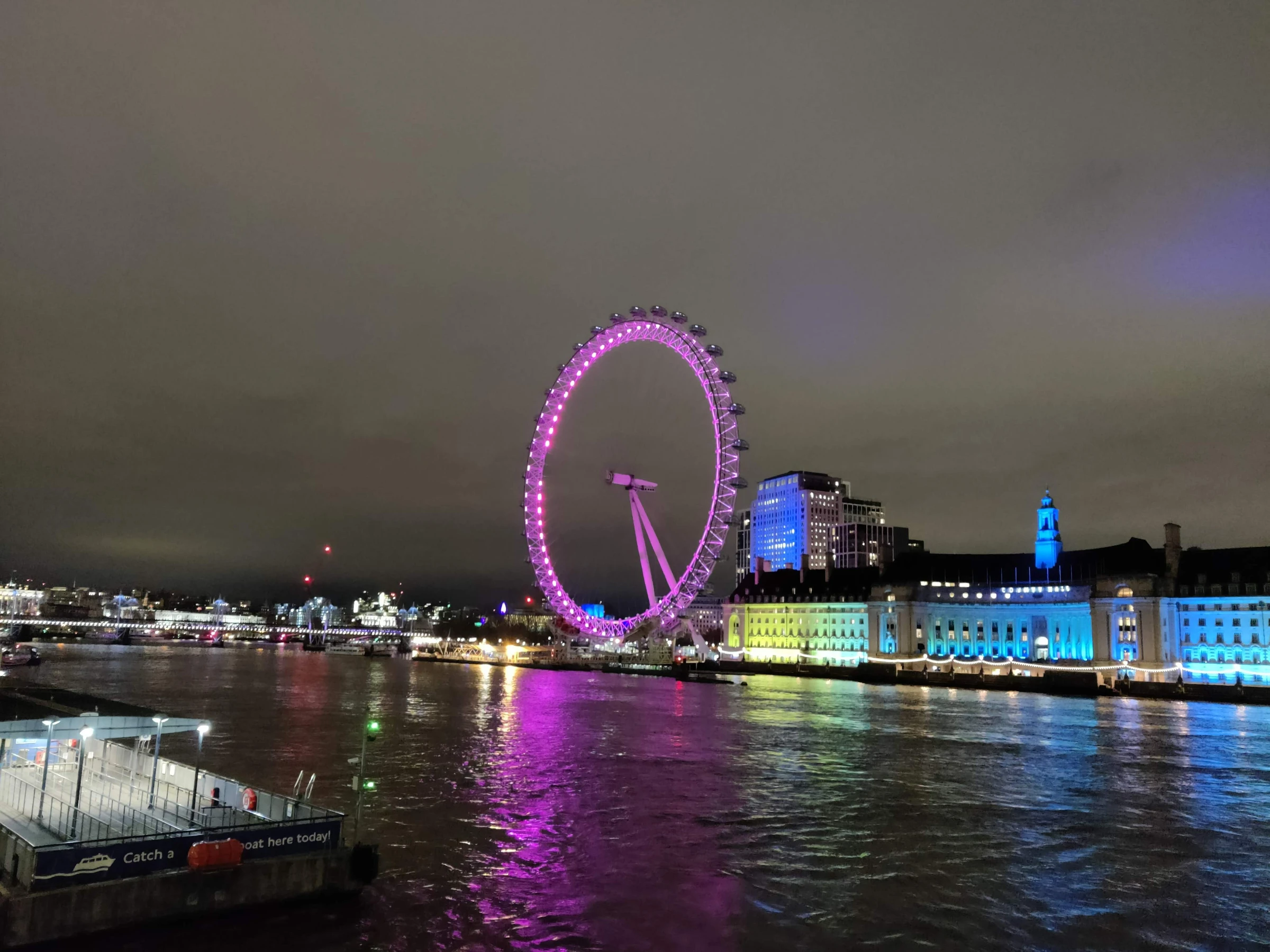 London Eye at night colored purple