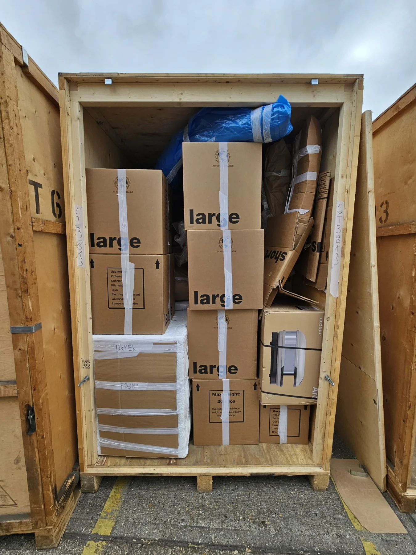 Organized storage unit in Rad’s West London facility, filled with canvas packing and wrapping art for moving items, optimized for art removals london and antique record storage.