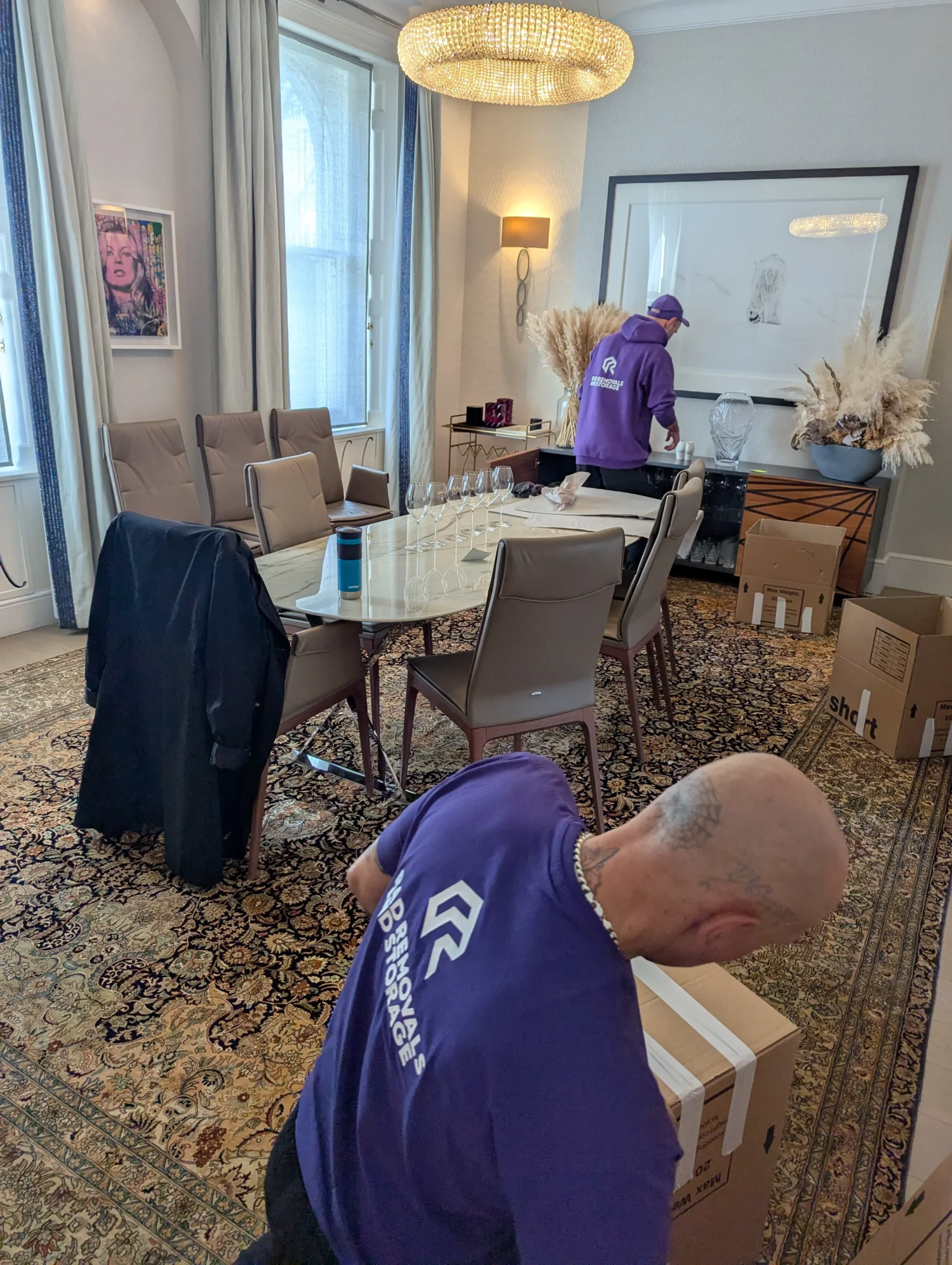 Rad’s team packing art and antiques with care in West London, showcasing professional packing services for secure transport and storage.