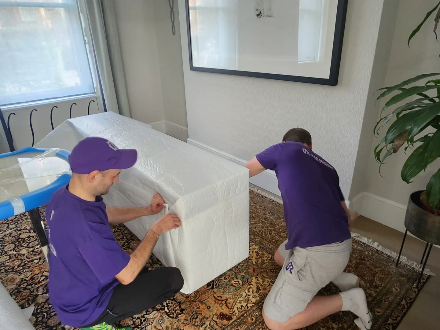 Rad’s team applying shipping packaging and shipping and packaging techniques in West London, securing fragile freight and art.